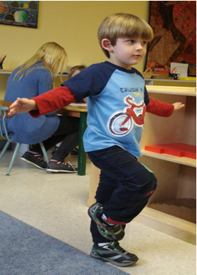 Child does Tree pose