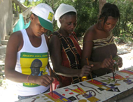 Haitian Artists working on a Scarf, Photograph by Ellen LeBow